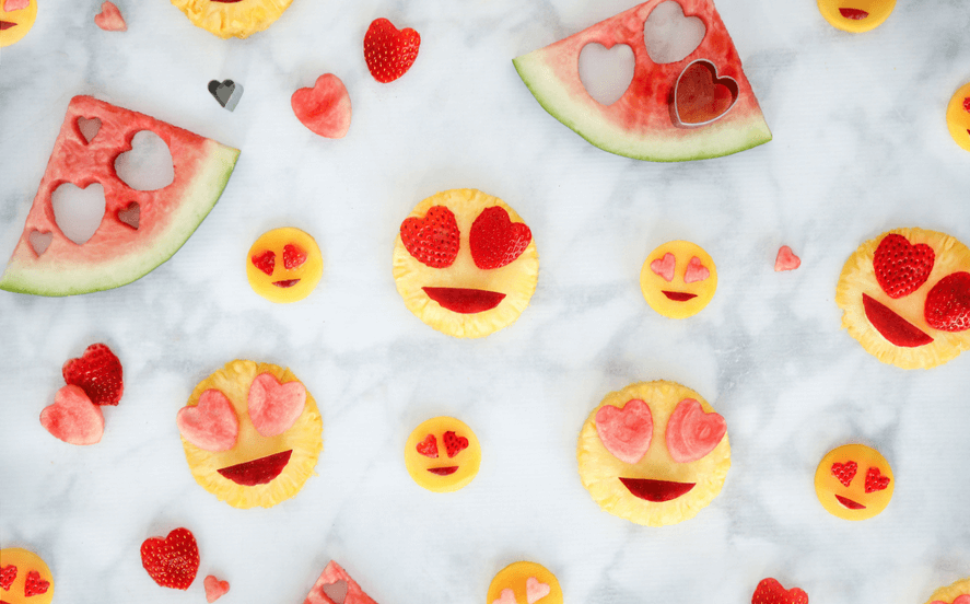 Emoji Party Ideas | Fun DIY food for an Emoji themed birthday party or a simple, no candy healthy Valentines Day snack for kids | Valentines day food ideas for clean eating families - great for school instead of a sweet treat, simply use heart shape cookie cutters and fruit!