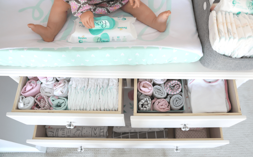 Organized dresser for baby using Konmari rolled up clothes system