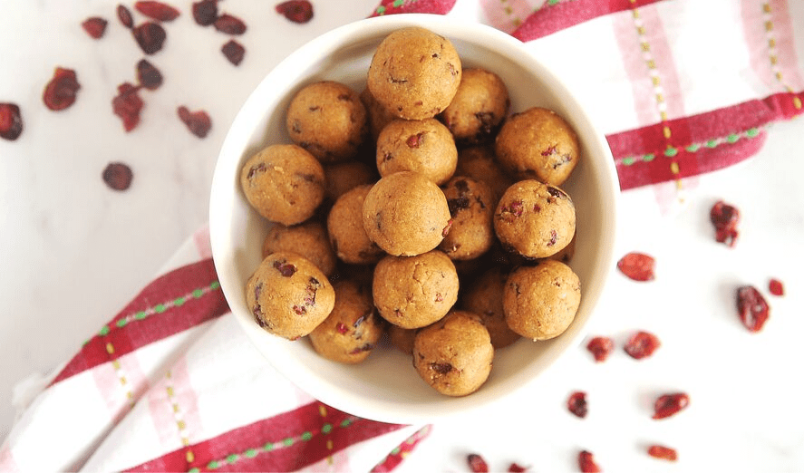 The Best No Bake Gingerbread Cranberry Protein Balls Recipe | Healthy, easy to make, & perfect for the holidays. A delicious energy bite recipe kids love to help make (and eat!). It's Keto, low carb, vegan, paleo and gluten free - great for clean eating!