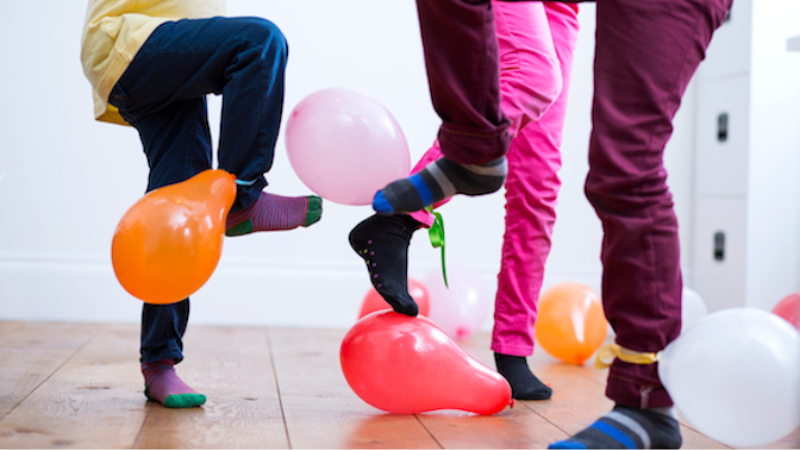 kids feet playing balloon stomp